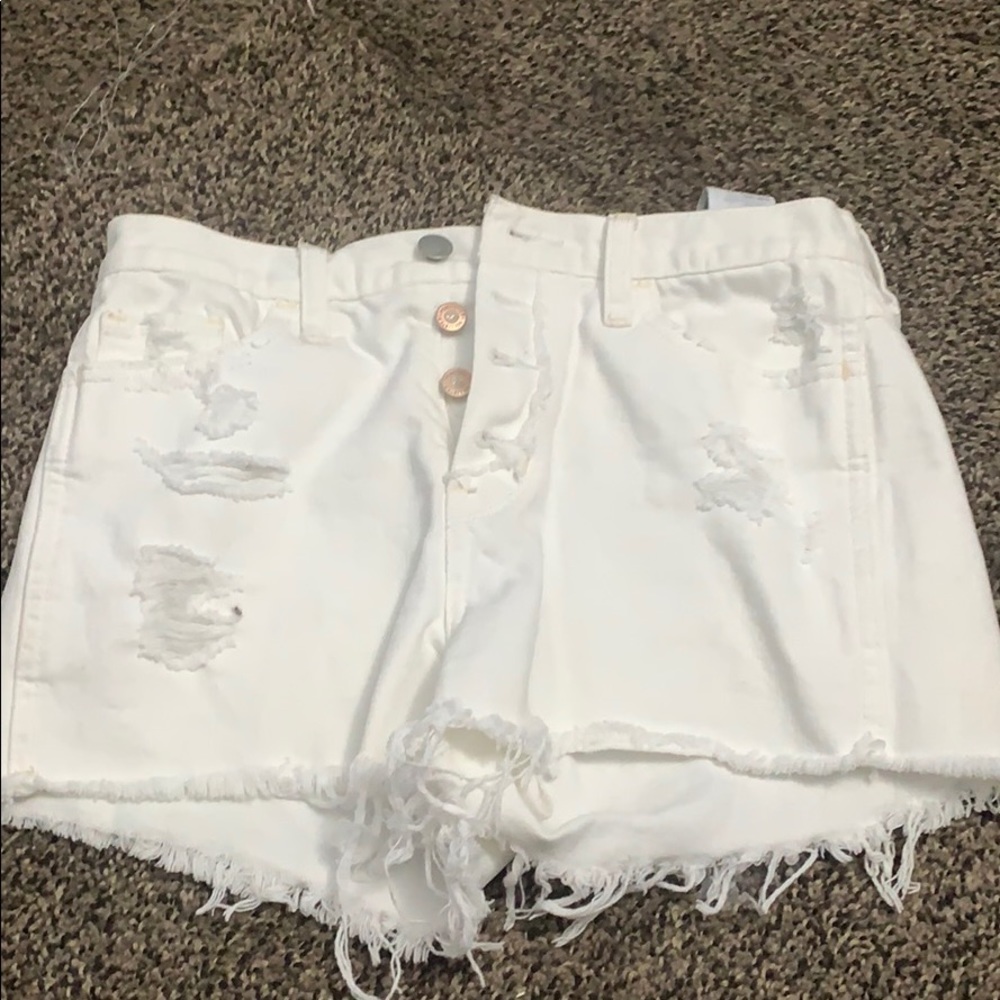 Ripped white denim shorts